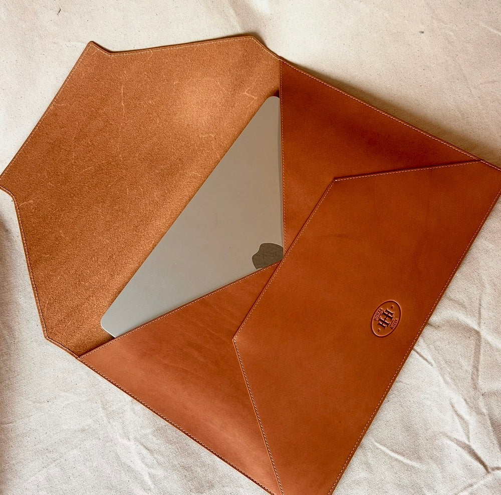 This is a leather folder, which has a nice flap and can carry your laptop or big magazine