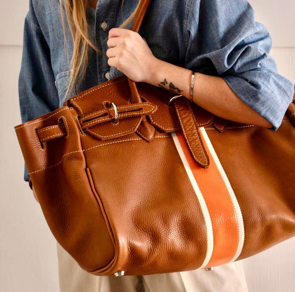 Hand painted orange and white stripe on a handmade duffel bag Homer Montecito