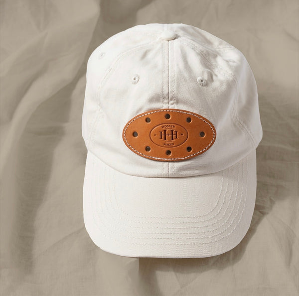 Canvas hat that has a patch says Homer Maker Montecito